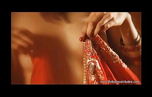 * Red sari Indian lady dances and strips and seduce